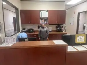 staff member behind desk